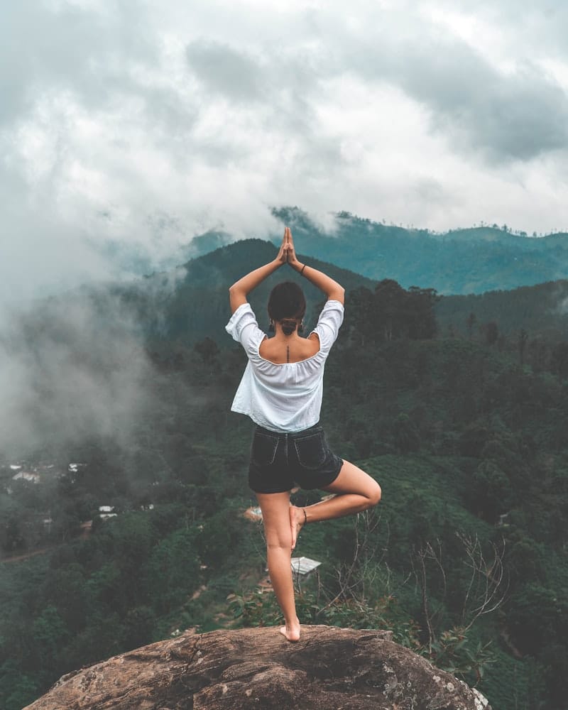 Woman meditating peacefully in soft morning light